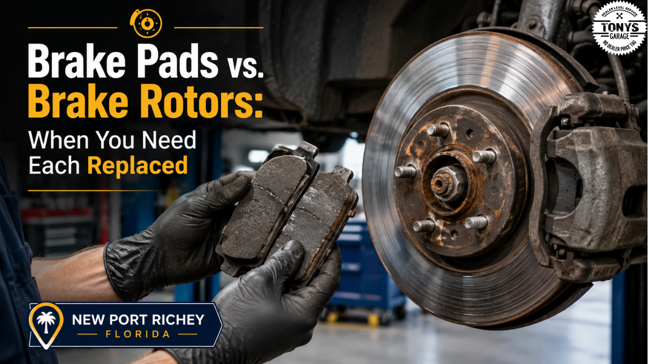 Close-up of worn brake pads and scored brake rotors on a vehicle being inspected at an auto repair shop in New Port Richey Florida